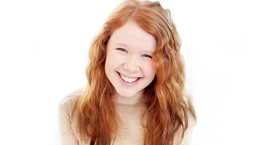 Young woman smiling with white teeth